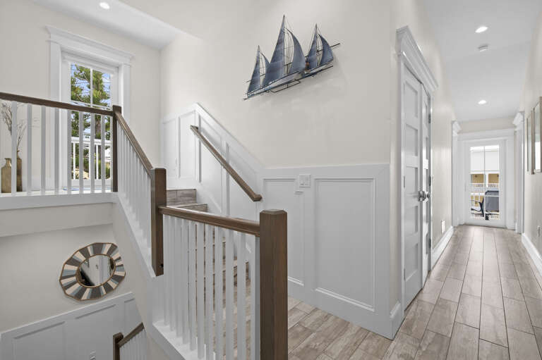 Take the stairs past the sailboat art and you'll know exactly what kind of trip this is before you're even halfway up.