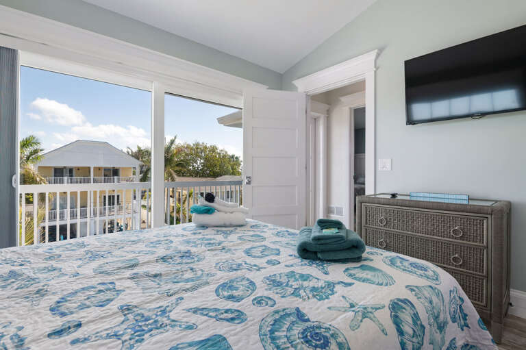 Step onto your own balcony and watch the neighborhood settle in for the evening — this room earns the quiet corner of the house.