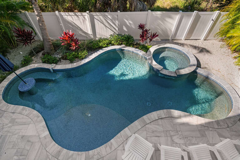 Step out front and exhale — mature landscaping, clean lines, and the kind of arrival that sets the tone the second you step out of the car.