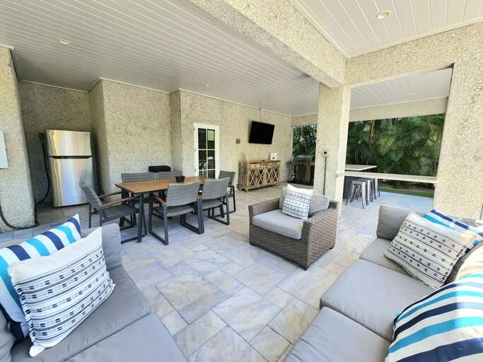 Watch the game outside without leaving the party — grab a cold one from the built-in fridge and there's still a sectional seat waiting when the sun gets to be too much.