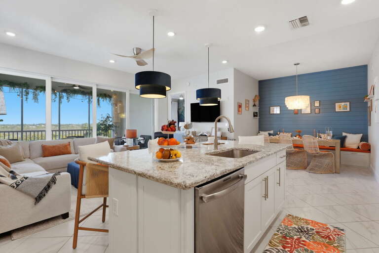 Gather the whole group in the main living and dining space — floor-to-ceiling windows flood the room with light and the layout gives everyone room to breathe.