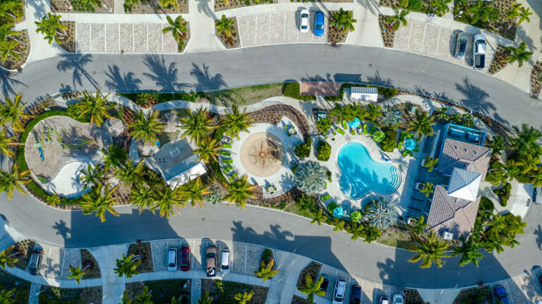 Grab a lounge chair and claim your spot before anyone else wakes up — the pool deck from above tells you everything you need to know about the resort setting.
