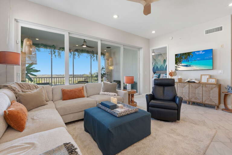 Open the balcony door and let the ocean breeze into the living room — this is the view you will be staring at while pretending to watch TV.