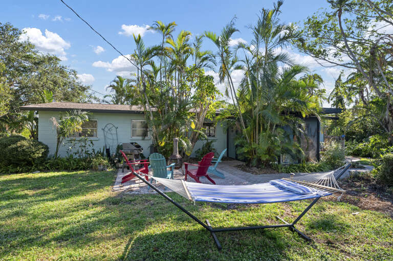 Catch a nap in the hammock when the sun dips behind the palms — this is what a proper afternoon off looks like.