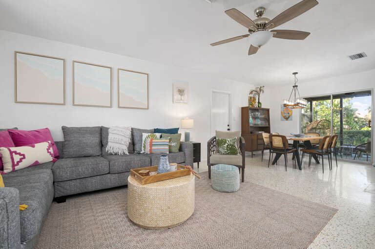 Feel it under your feet the first morning — the original terrazzo runs throughout and holds its own against anything new.