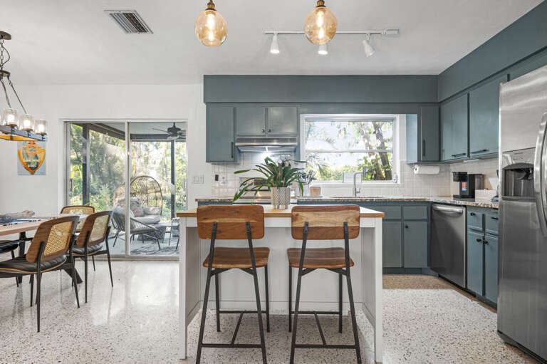 Pour the coffee and eat breakfast while your backyard does what Florida backyards do — let the morning come to you.