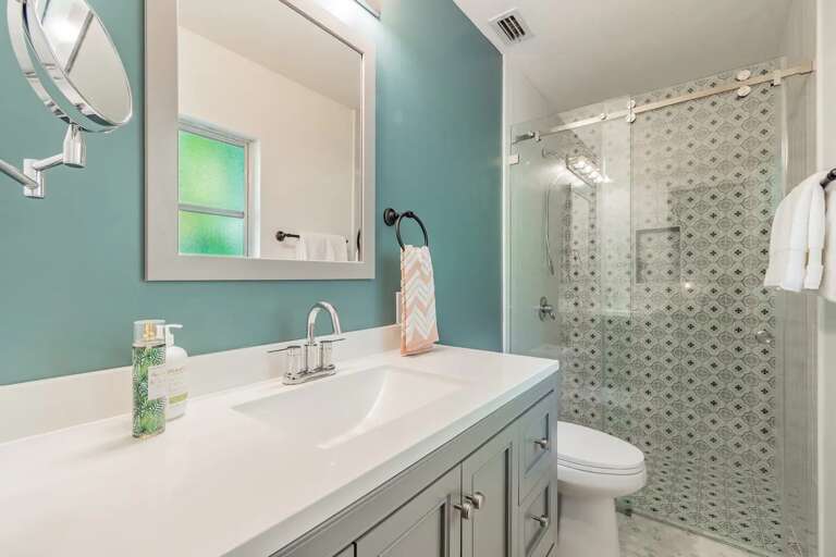 Rinse off in the walk-in shower after a long beach day — the primary ensuite is newly renovated and all yours.