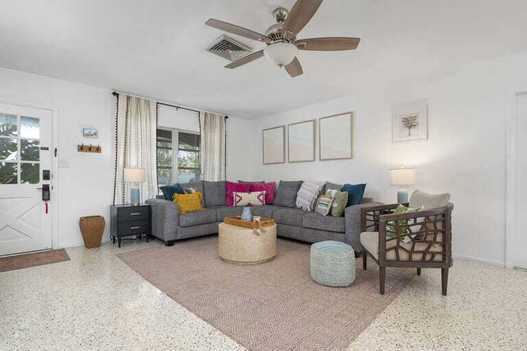 Settle in on the big sectional after a long beach day — the living room fits everyone without anyone sitting on the floor.