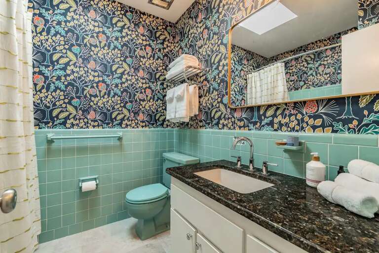 Step into a 1960s original — retiled, updated, and holding onto the details that make it worth a look.