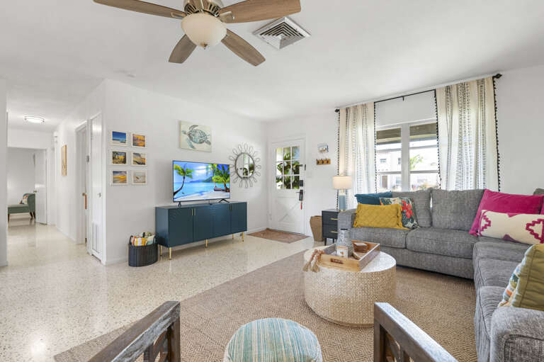 Step from the living room into the dining area without losing the conversation — everything flows together the way it should.