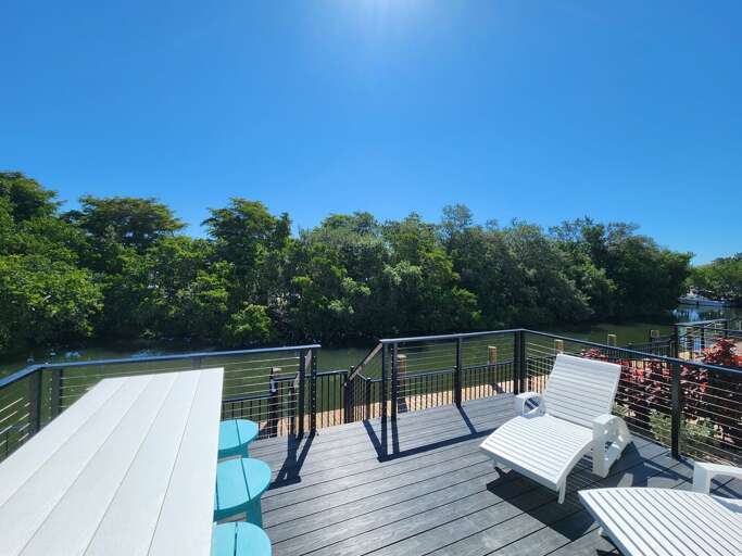 The back deck at golden hour and watch the canal turn every color right in front of you.