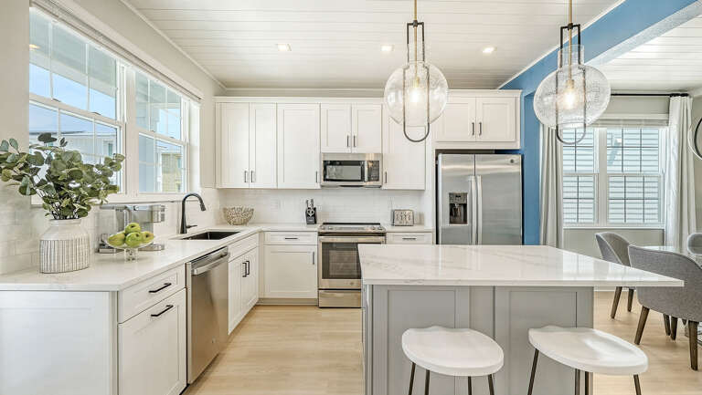 Fill the sink while someone else grabs a stool at the island and keeps you company.