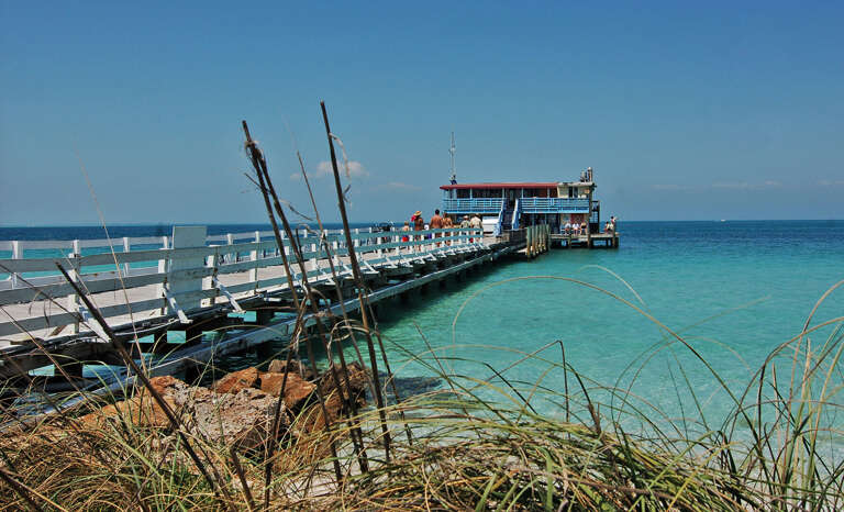 Fish off the long pier or just walk it end to end — the view already belongs to you.