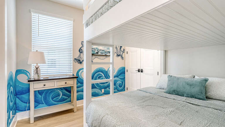 Settle the kids into the bunk room while the coastal mural keeps your vacation feeling going after dark.