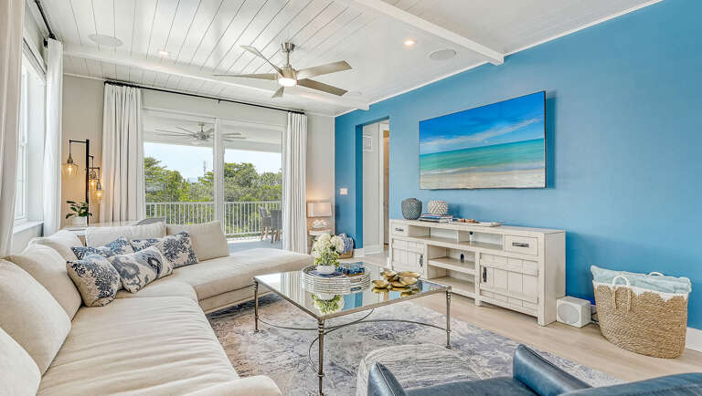 Settle into the living room for your movie night once the pool towels are finally hung up to dry.