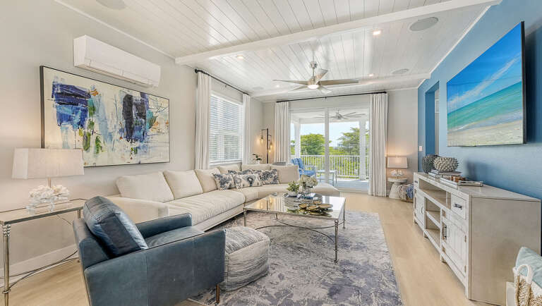 Slide the doors open and let your living room spill straight onto the balcony for the evening.