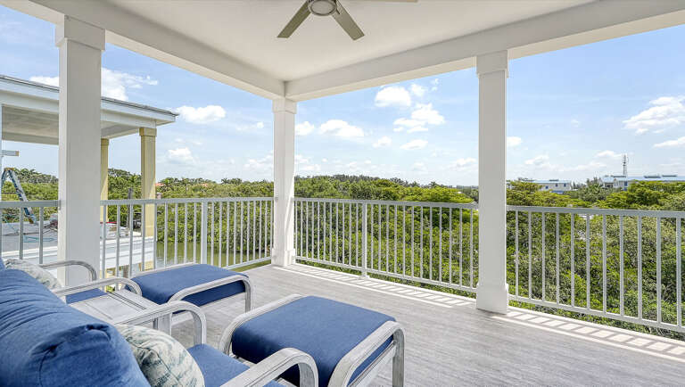Stretch out on the balcony sofa with the fan on low and let your whole afternoon disappear into the greenery.