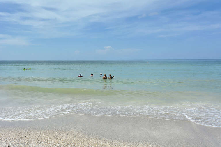 Wade into the Gulf right where everyone else already is, warm water and easy entry for you the whole way.