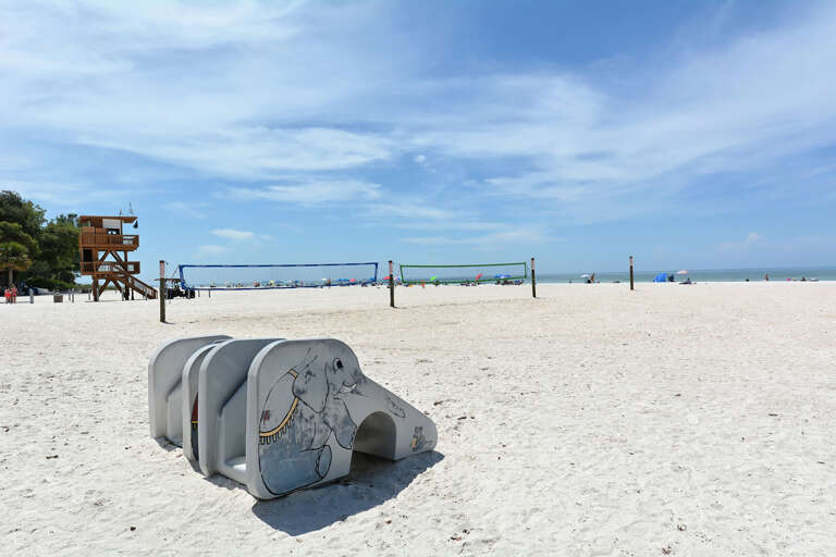 Wander past the beach slides on your way to the water and let the kids climb on it after.