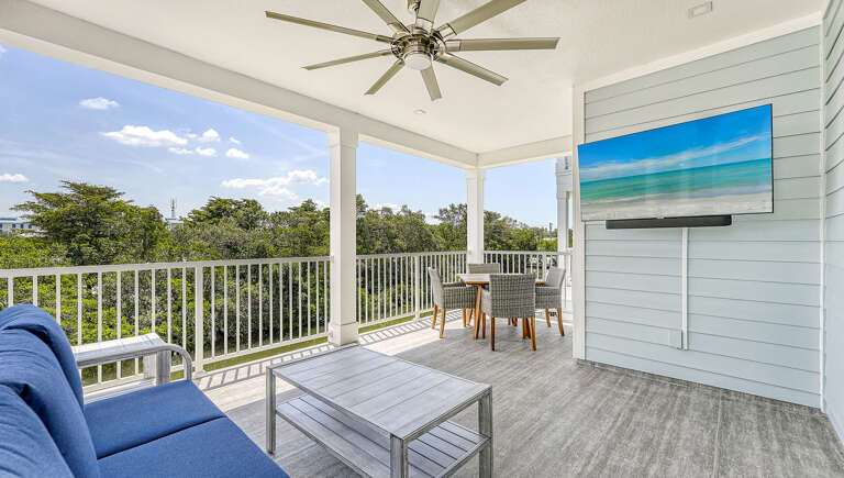 Watch the game on the balcony TV with dinner going at your back and the fan keeping the breeze moving.
