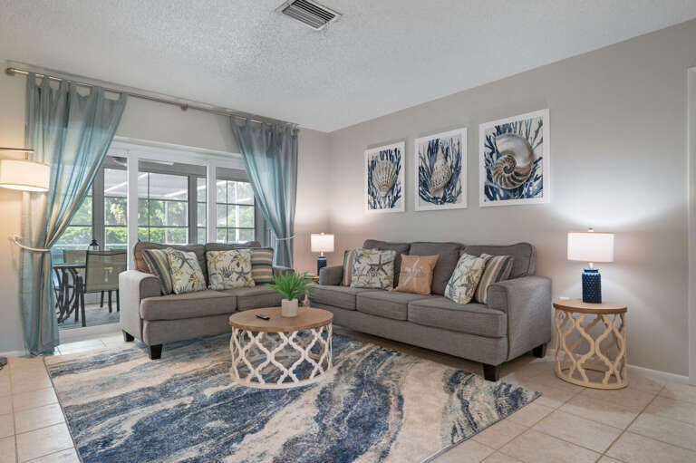 Living room overlooks the patio and is right outside the master bedroom, this living room offers a sleeper sofa and large tv.