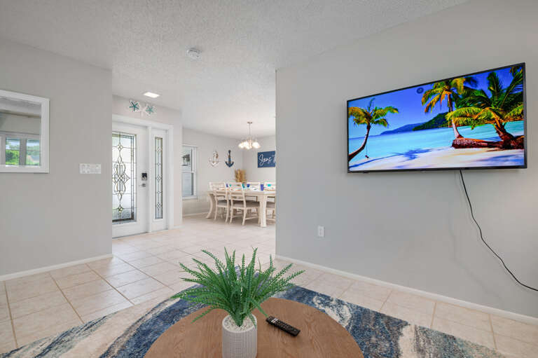Living room overlooks the patio and is right outside the master bedroom, this living room offers a sleeper sofa and large tv.