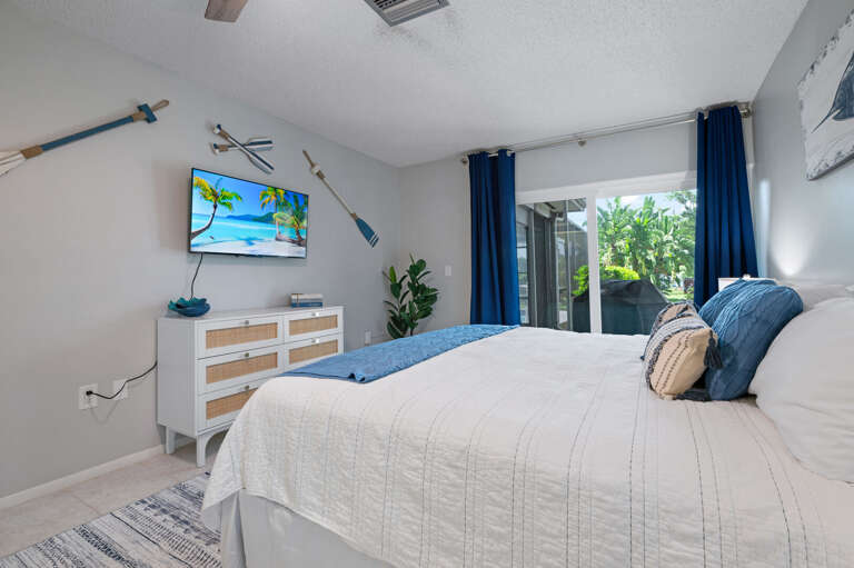 Master bedroom with master bathroom, king size bed, large TV, Makeup vanity, Large walk in closet.