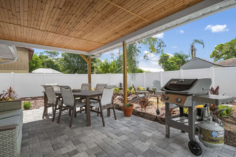 Flip something on the grill, set the outdoor table, and let the whole group eat under the covered patio without anyone rushing inside. This is dinner, done right.