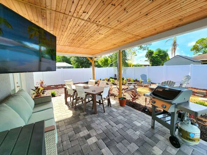 Flip something on the grill, set the outdoor table, and let the whole group eat under the covered patio without anyone rushing inside. This is dinner, done right.