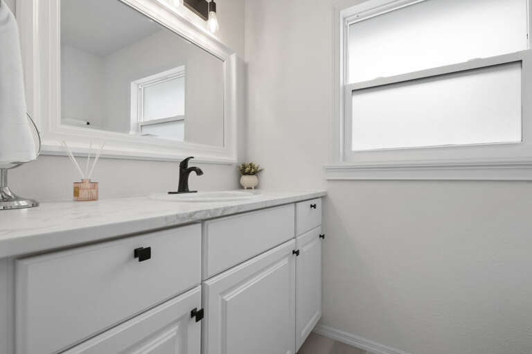 You'll notice the bathroom details without looking for them —marble counter, black faucet. Someone thought through the finishes.