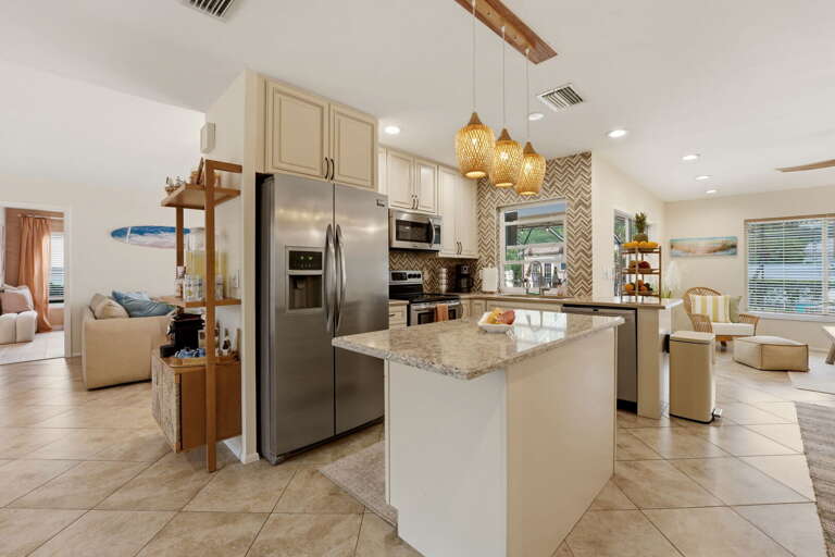 A full professional kitchen — island seating, all the appliances, and the open-plan flow that makes group cooking actually enjoyable.