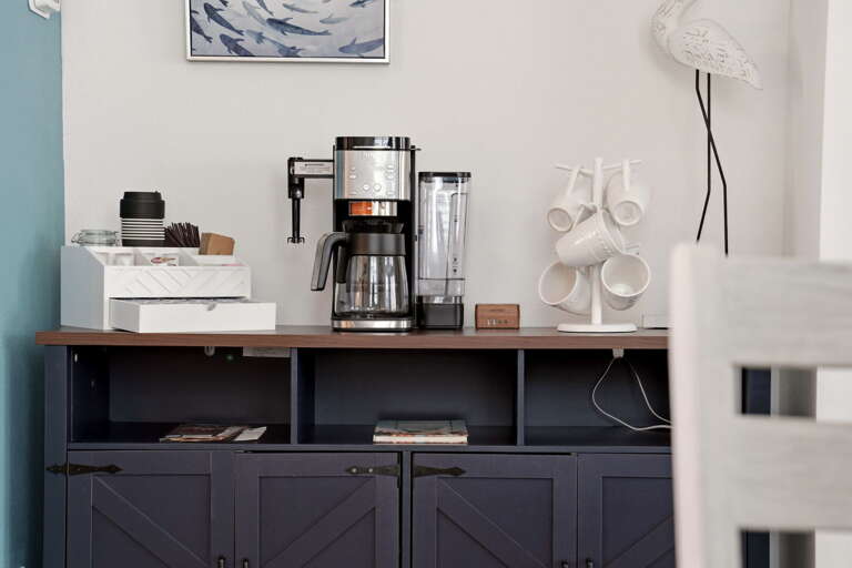 A dedicated coffee and beverage bar sits just off the dining area - stainless dual-brew coffee maker and all your morning essentials.