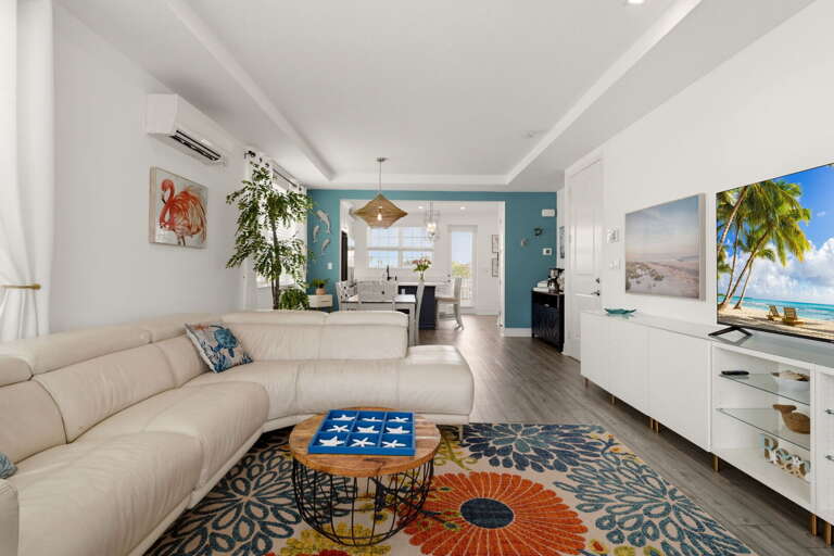 The open-concept living and dining area flows effortlessly toward the chef's kitchen, making entertaining feel completely natural