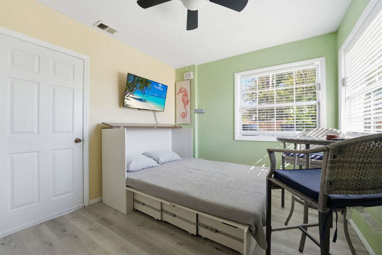 Find your corner in the game room -- the desk side is perfect when someone needs to handle work mid-trip without disappearing from the group.