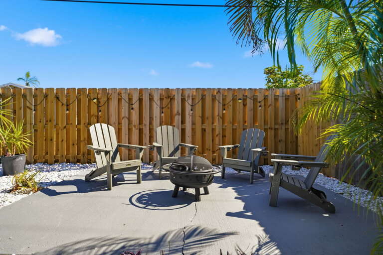 Pull up an Adirondack and settle in. This fire pit was built for good company and clear Florida skies.