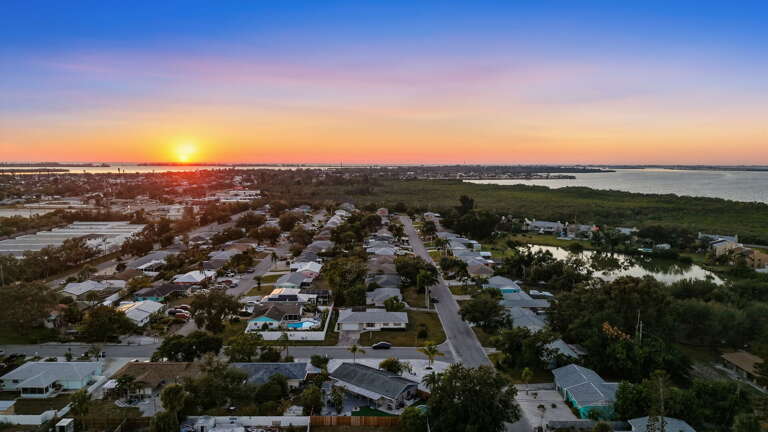 Watch the aerial golden hour over the coast and understand exactly what 'minutes to Anna Maria Island' means from this house.