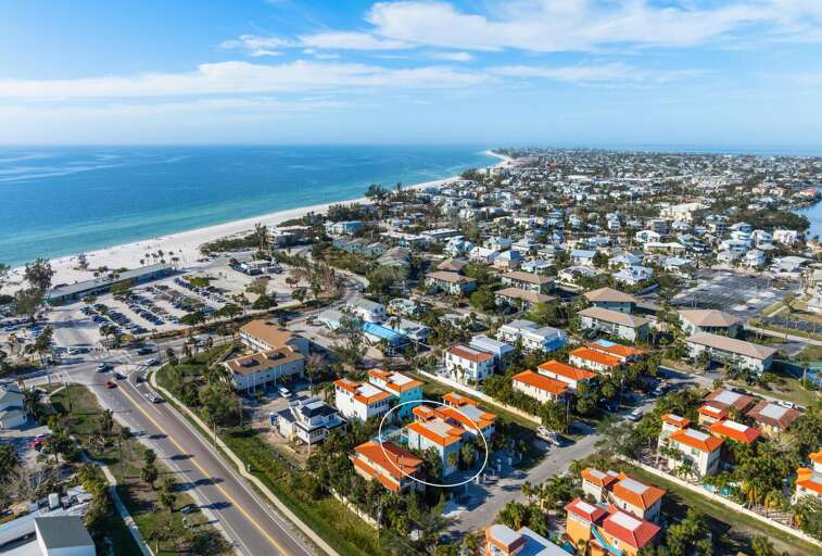 See the beach right there in the aerial — the property is circled, the Gulf is a short walk away, and this is genuinely one of the closest non-beachfront spots on the island.