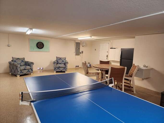 Challenge your group to ping pong or talk trash at the dart board — the game room is where the night's plans fall apart in the best possible way.