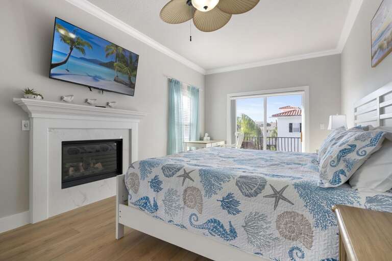 Slide the balcony door open and let the ocean air in — the king bed and fireplace do the rest, and tomorrow can wait as long as you need.
