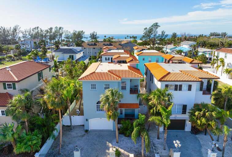 Walk two blocks and you're standing on the Gulf — from the rooftop you can see the water and feel the breeze before you've even left the property.