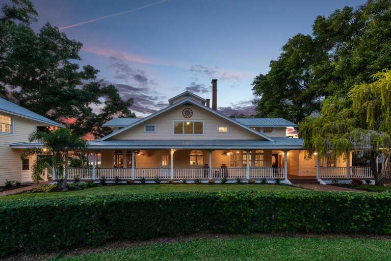 Pull in after dark and watch the whole house glow from the circular drive — this is the welcome home moment.