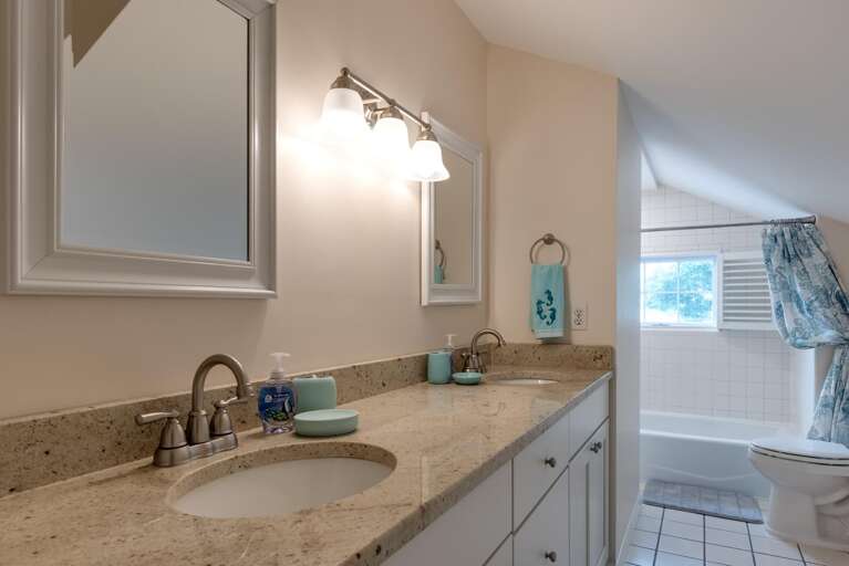 Share the double sinks in the morning and let whoever's in the tub take their time — nobody's rushing you here.