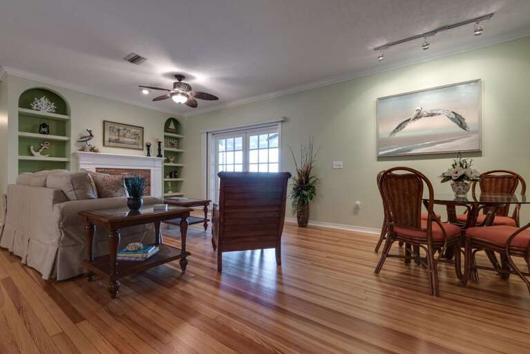 Sink into the living room after a full day on the water — there's a second table right here for cards, coffee, or catching up.