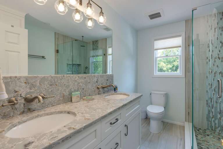 Step under the rain shower head after a day on the boat — this bathroom got a full remodel just for your stay.