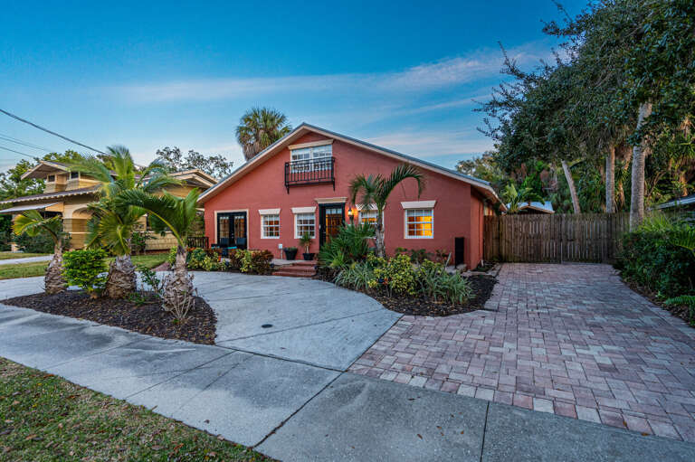 Drive up at dusk and the warm glow through every window tells you the house is already waiting. This is what arriving on vacation should feel like.