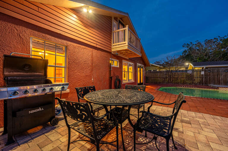 Grill on gas, carry plates to the patio table, eat under the balcony lights. Bradenton summer nights were built for exactly this.