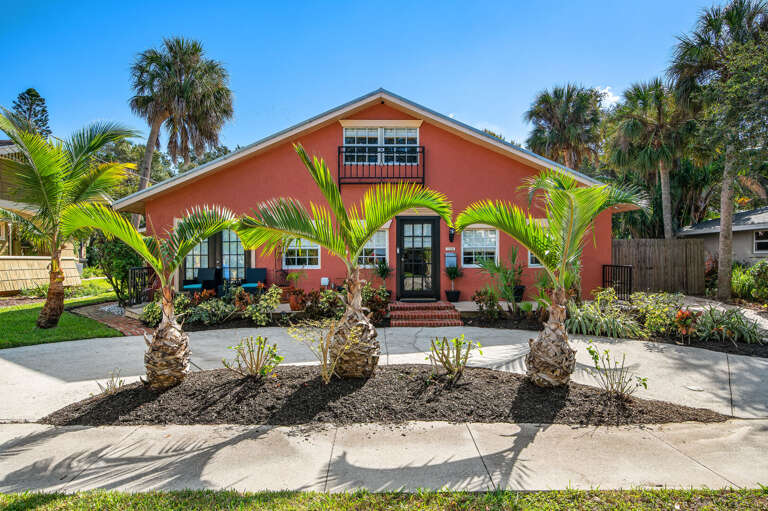 Pull up to coral-pink walls and queen palms and know immediately that you picked the right place.