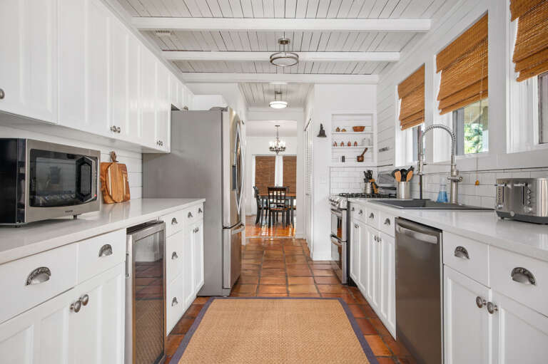 Get real cooking done in a kitchen stocked for an actual family: stainless everything, full-size fridge, dishwasher, counter space to spare. Mid-week grocery run optional.