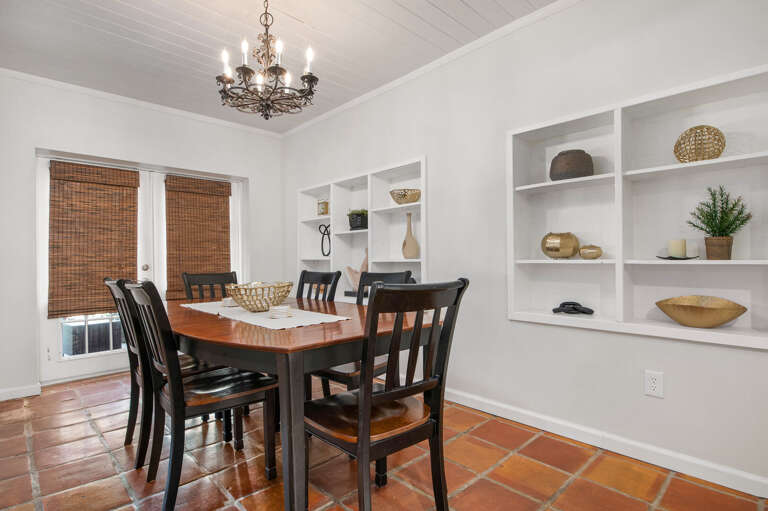 Sit down to dinner under a real chandelier at a table that belongs in a room like this. Dinner here feels different than eating off paper plates.