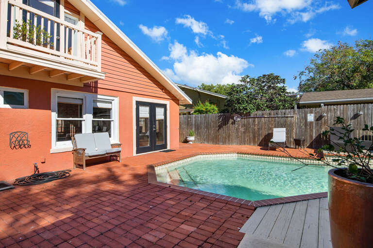 Take stock from here: pool, bar, cabana, and a patio big enough for the whole crew. Then go jump in.